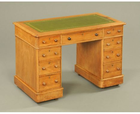 A Victorian mahogany pedestal desk, with green tooled leather writing surface and fitted with three frieze drawers with woode