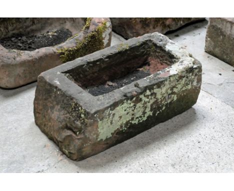 A rectangular sandstone trough.  Height 27 cm, width 69 cm, depth 38 cm.