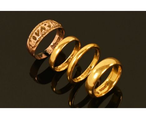 Three 22 ct gold wedding bands, Sizes O, M/N and Q/R, combined weight 17.6 grams, together with a 9 ct gold Mizpah ring, 2.1 