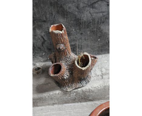 A tree form glazed earthenware strawberry planter.  Height 53 cm, maximum width +/- 50 cm.