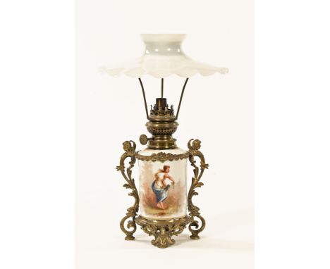 A cylindrical milk glass oil lamp, with canopy type shade, brass fittings and rococo metal mounts.  Overall height including 