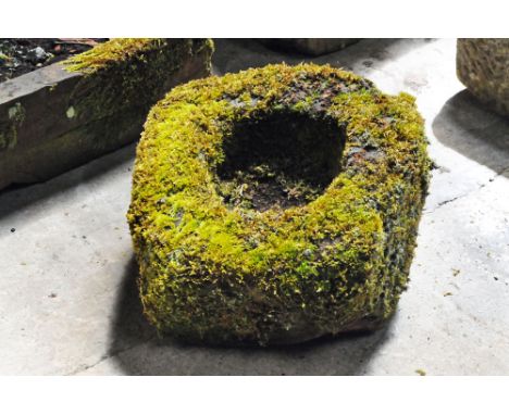 A square form sandstone trough, with circular aperture.  Height 30 cm, width 43 cm, depth 43 cm.
