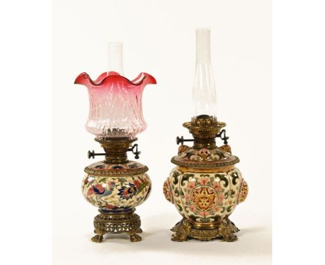 Two Victorian ware and brass mounted oil lamp bases, one with shade. Tallest excluding chimney 30 cm. CONDITION REPORT: The c