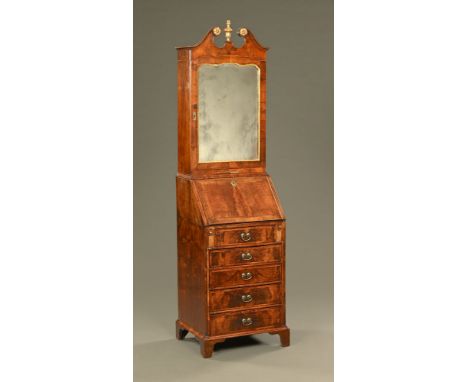 A part 18th century and later walnut bureau bookcase, with swans neck pediment above a mirrored door with candle slide beneat