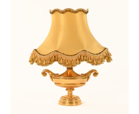 A gilt metal vase and cover table lamp, complete with shade.  Height including shade 49 cm.