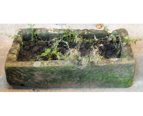 A rectangular sandstone trough.  Height 23 cm, length 82 cm, depth 42 cm.