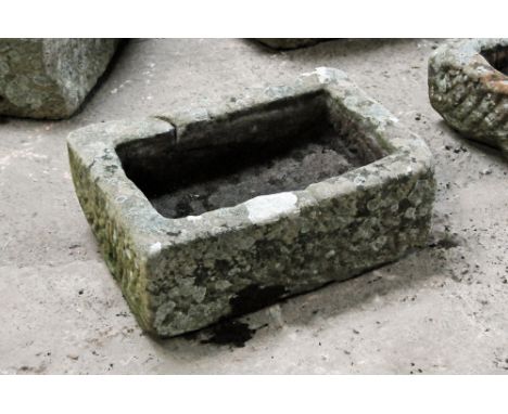 A rectangular sandstone trough.  Height 23 cm, width 62 cm, depth 43 cm.