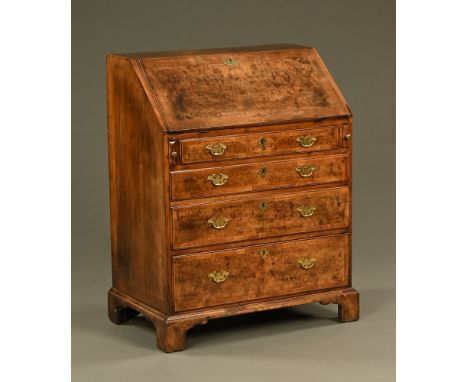 An 18th century walnut bureau, well figured, the slope front opening to a fitted interior and with four graduated drawers wit