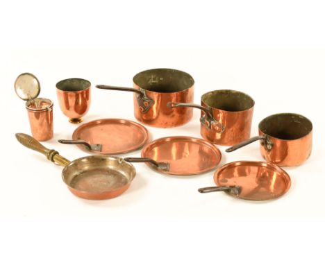 A collection of copper pans, skillets and lids and two cylindrical vessels. CONDITION REPORT: All items in this lot are very 