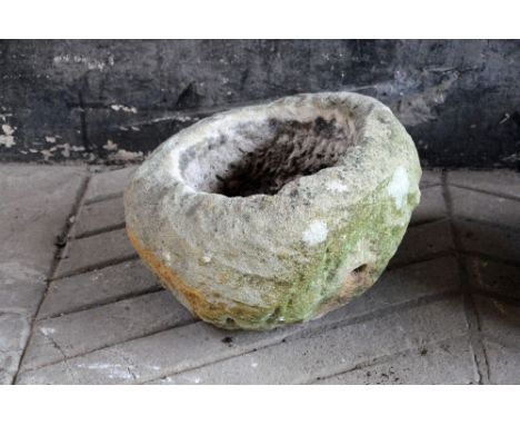 A sandstone trough, shaped cylindrical.  Diameter +/- 50 cm, height +/- 35 cm.