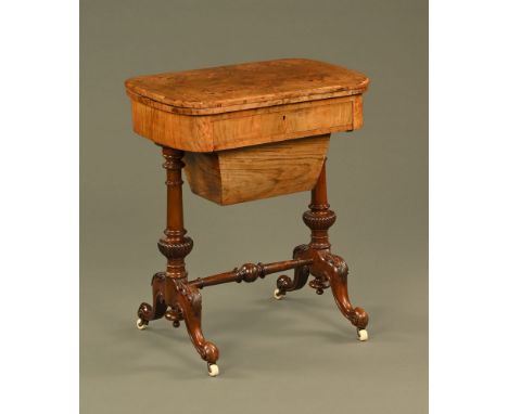 A Victorian walnut turnover top combined games and work table, cribbage, backgammon and chess, with sliding wooden bag raised