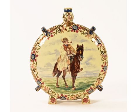 J Fisher Budapest, a cylindrical enamel decorated circular vase on two feet with a painted scene depicting a man on horseback