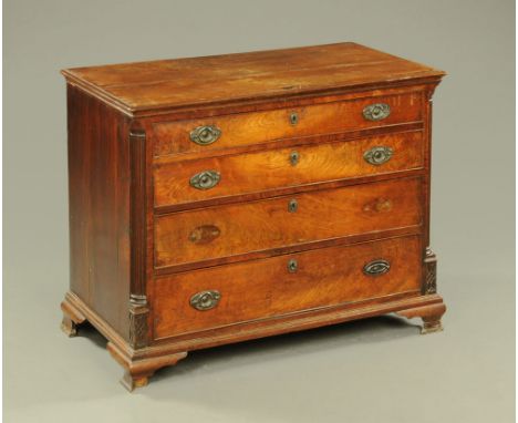 A George III mahogany crossbanded Lancashire chest of four drawers, with brass drop handles with oval backplates and with flu