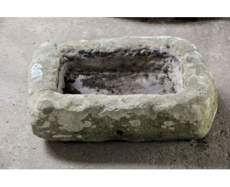 A rectangular sandstone trough.  Height 20 cm, width 60 cm, depth 41 cm.