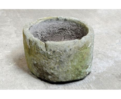 A large cylindrical sandstone trough.  Height 40 cm, diameter 62 cm.