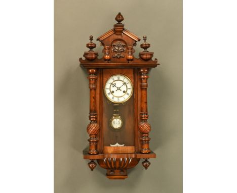 A late 19th century walnut Vienna regulator wall clock, with two train spring driven movement.  Height 78 cm, width 39 cm (se