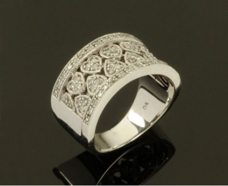 A 9 ct white gold dress ring, set with diamonds weighing +/- .31 carats.  Size N.