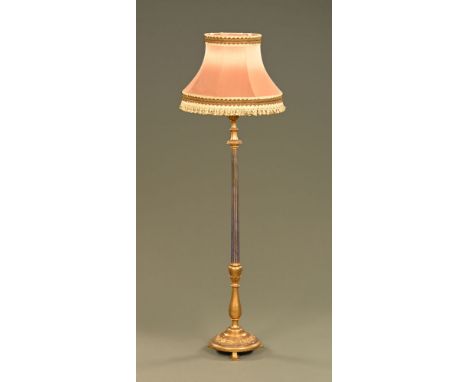 A gilt and blue painted lamp standard, with circular base and short feet.   CONDITION REPORT: the lamp is currently lit in th