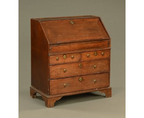 An 18th century oak bureau, with slope front to fitted interior with well and with two short and two long graduated drawers w