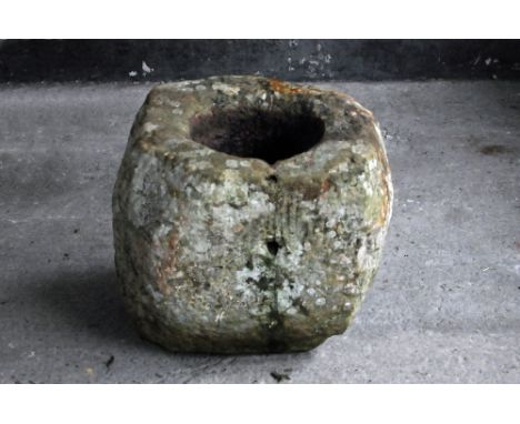 A sandstone trough, large form with circular aperture.  Height +/- 56 cm, maximum width 60 cm, depth 56 cm.