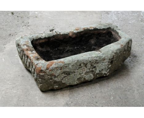 A rectangular form sandstone trough with angled corner.  Height 21 cm, width 70 cm, depth 44 cm.