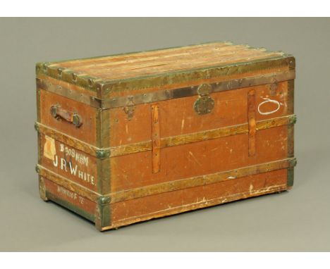 A vintage brass bound and canvas steamer trunk, with leather carrying handle.  Height 60 cm, width 98 cm, depth 55 cm.
