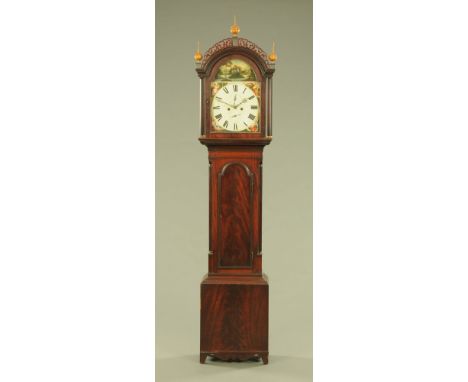 A late Georgian mahogany longcase clock, with fretwork pediment arched painted dial and two train striking movement with long