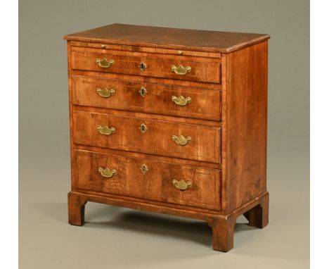 An 18th century walnut chest of drawers, with slide above four graduated drawers with brass drop handles and shaped backplate