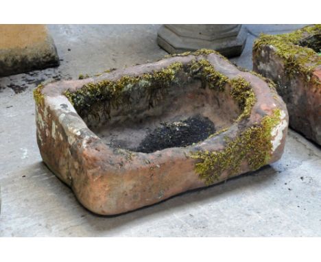 A rectangular sandstone trough.  Maximum height 28 cm, width 70 cm, depth 44 cm.