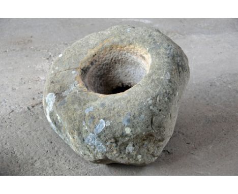 A sandstone trough, sloping.  Height at tallest point 49 cm, diameter +/- 56 cm.