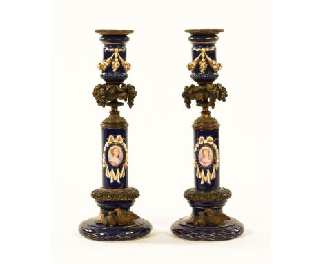 A pair of 19th century porcelain gilt metal mounted portrait candlesticks, each painted with an oval portrait panel of a fema