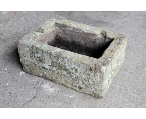 A rectangular sandstone trough.  Height 30 cm, width 71 cm, depth 49 cm.