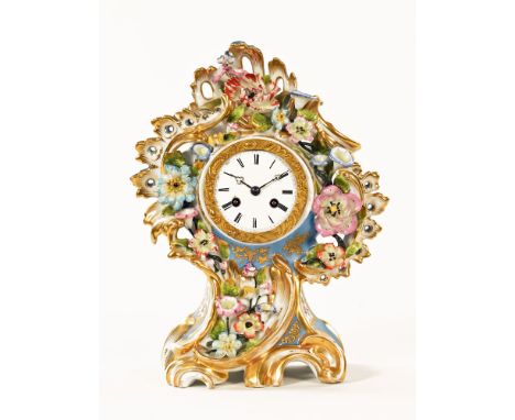 A 19th century French porcelain clock, with floral encrustations to the rococo case, and with two train striking movement.  H