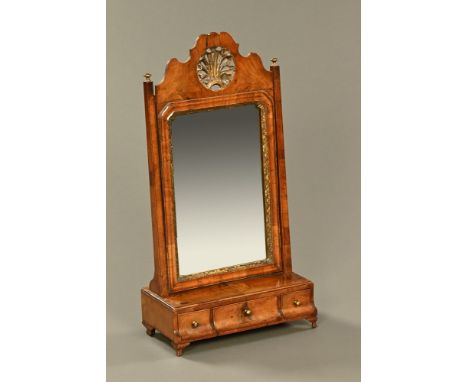 A 19th century walnut veneered dressing mirror, the base fitted with three drawers and raised on bracket feet.  Height 79 cm,
