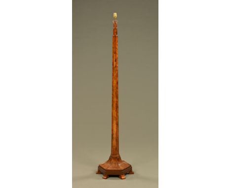 A walnut lamp standard, circa 1930 with faceted column and hexagonal base raised on short feet. CONDITION REPORT: The lamp st