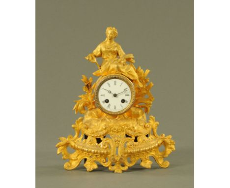 A late 19th century gilt spelter mantle clock, with female figure mount, with two train striking movement complete with key a