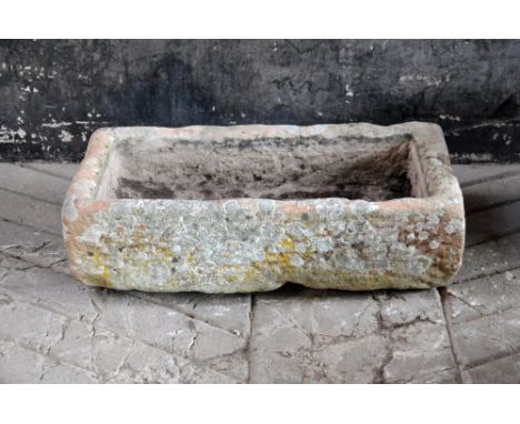 A sandstone trough, with drain hole.  Height 25 cm, width 84 cm, depth 43 cm.