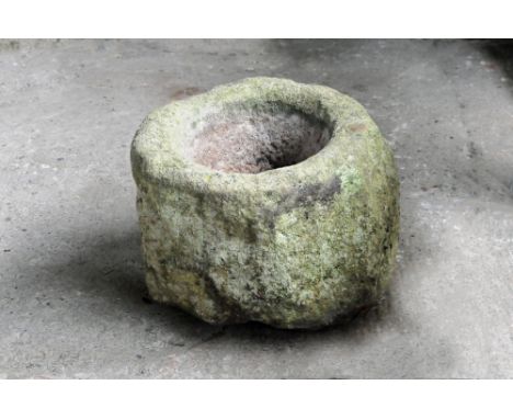A sandstone trough, of shaped circular outline.  Height 34 cm, width +/- 50 cm, depth +/- 49 cm.