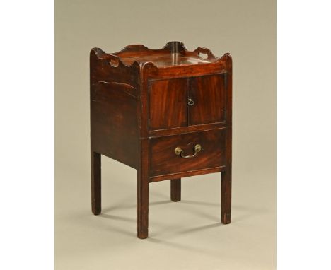 A Georgian mahogany tray topped commode, converted to a bedside cabinet and fitted with panelled cupboard doors and a dummy d