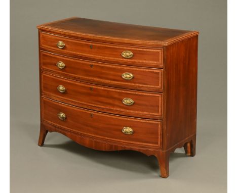 A George III inlaid mahogany bowfronted chest of drawers, four long drawers with brass drop handles with oval backplates and 