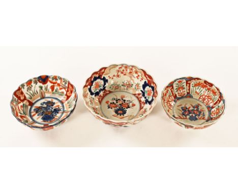 Three late 19th century Imari pattern earthenware enamel decorated bowls.  Largest 21.5 cm diameter.