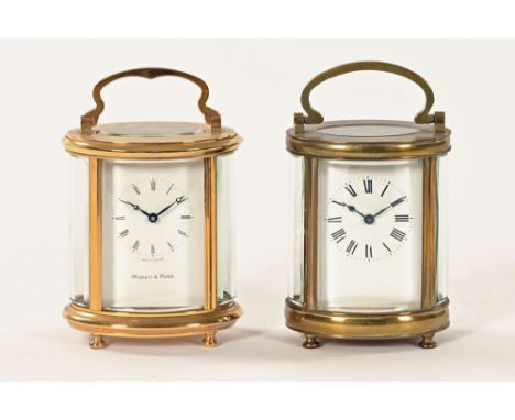 A Mappin &amp; Webb brass oval carriage clock, together with a second carriage clock with no makers name.  Each +/- 12 cm hig