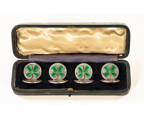 A cased set of four silver and enamelled four leaf clover menu holders or place setting markers, Chester hallmark date letter