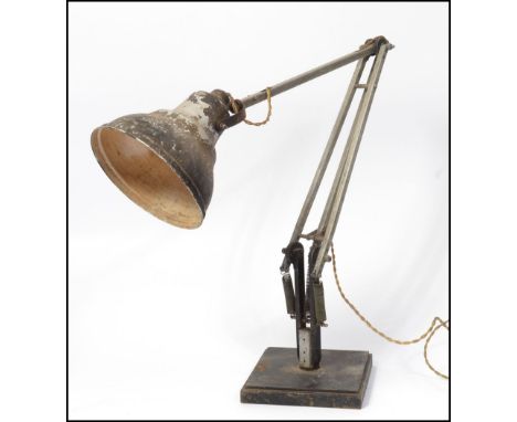 A 20th century Air Ministry stamped anglepoise Herbert Terry &amp; sons desk lamp. Raised on squared base with angle adjustab
