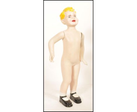 An early to mid 20th Century retro vintage point of sale shop advertising display composite mannequin of a blonde boy with pa