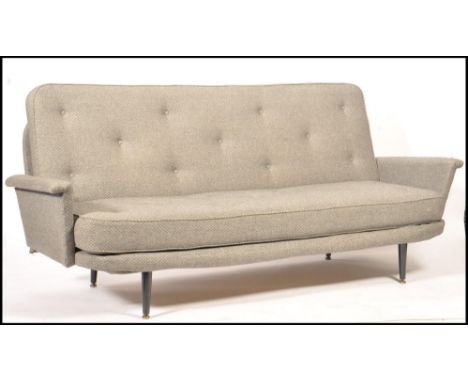 Vono - A 1950's vintage sofa bed having a metal and sprung frame with angular armrests finished in an ash grey woolen herring