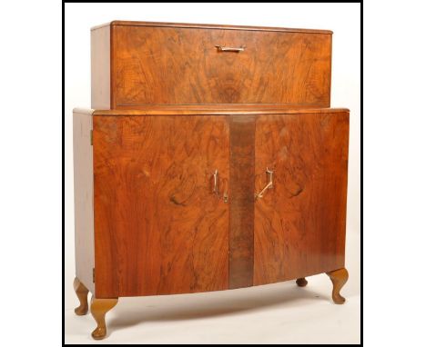 Turnbridge - A 1940's vintage retro post war art Deco teak and walnut cocktail / drinks cabinet having the metamorphic action