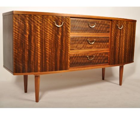 Morris Of Glasgow - A mid 20th Century retro vintage figured black walnut bow fronted sideboard having a run of three graduat