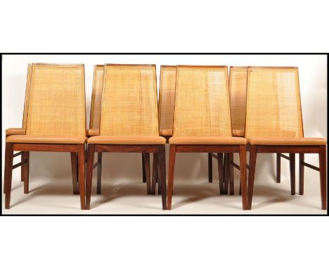 Dyrlund - A 20th Century Danish retro vintage set of 6x teak wood dining chairs having the tall cane weaved backs and tan lea