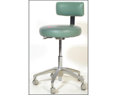 A 20th century Industrial medical theatre swivel - office chair. The stainless steel 5 point base with castors having medical